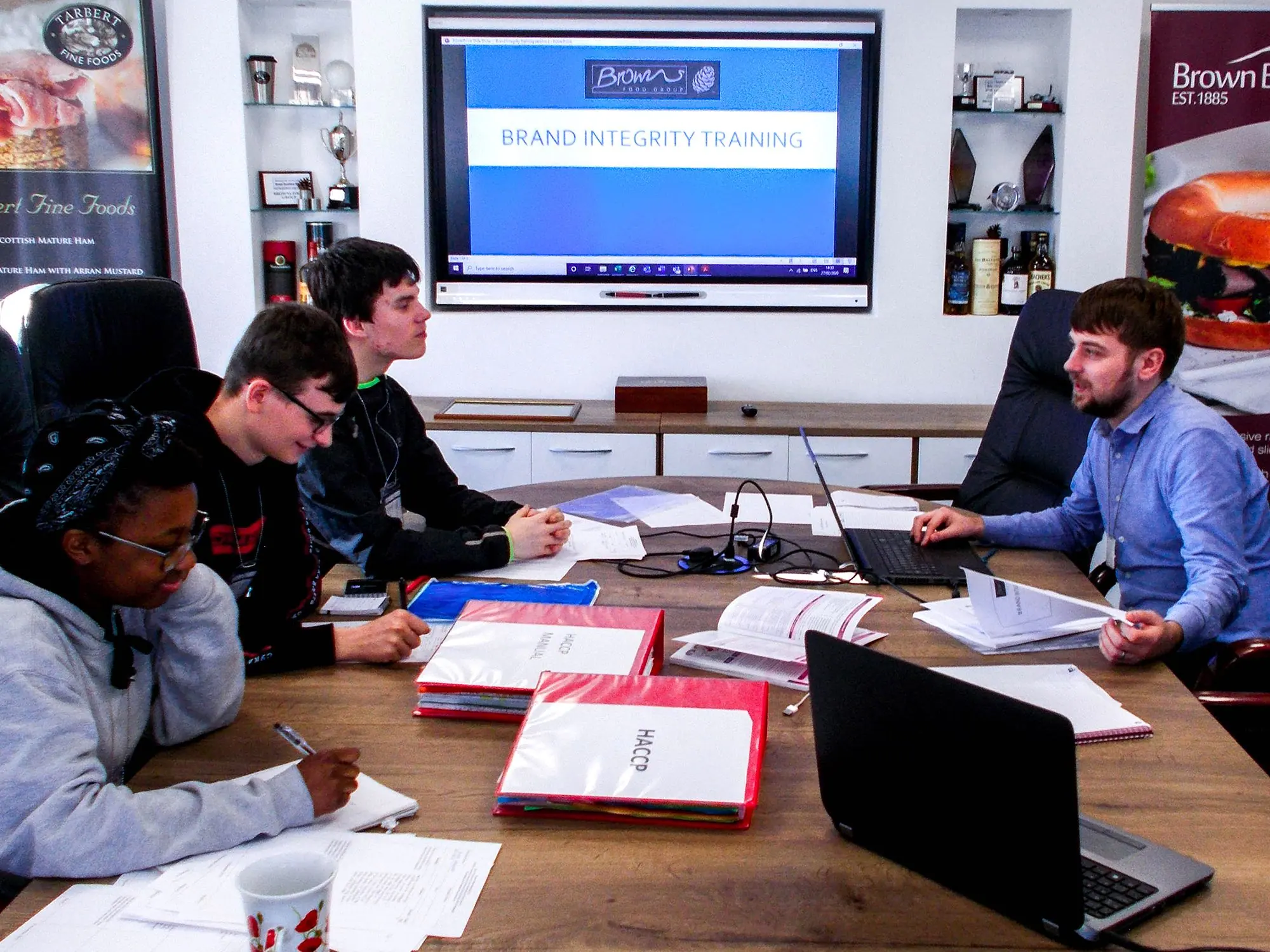 Foundation Apprentices in a brand identity training session with a Browns colleague