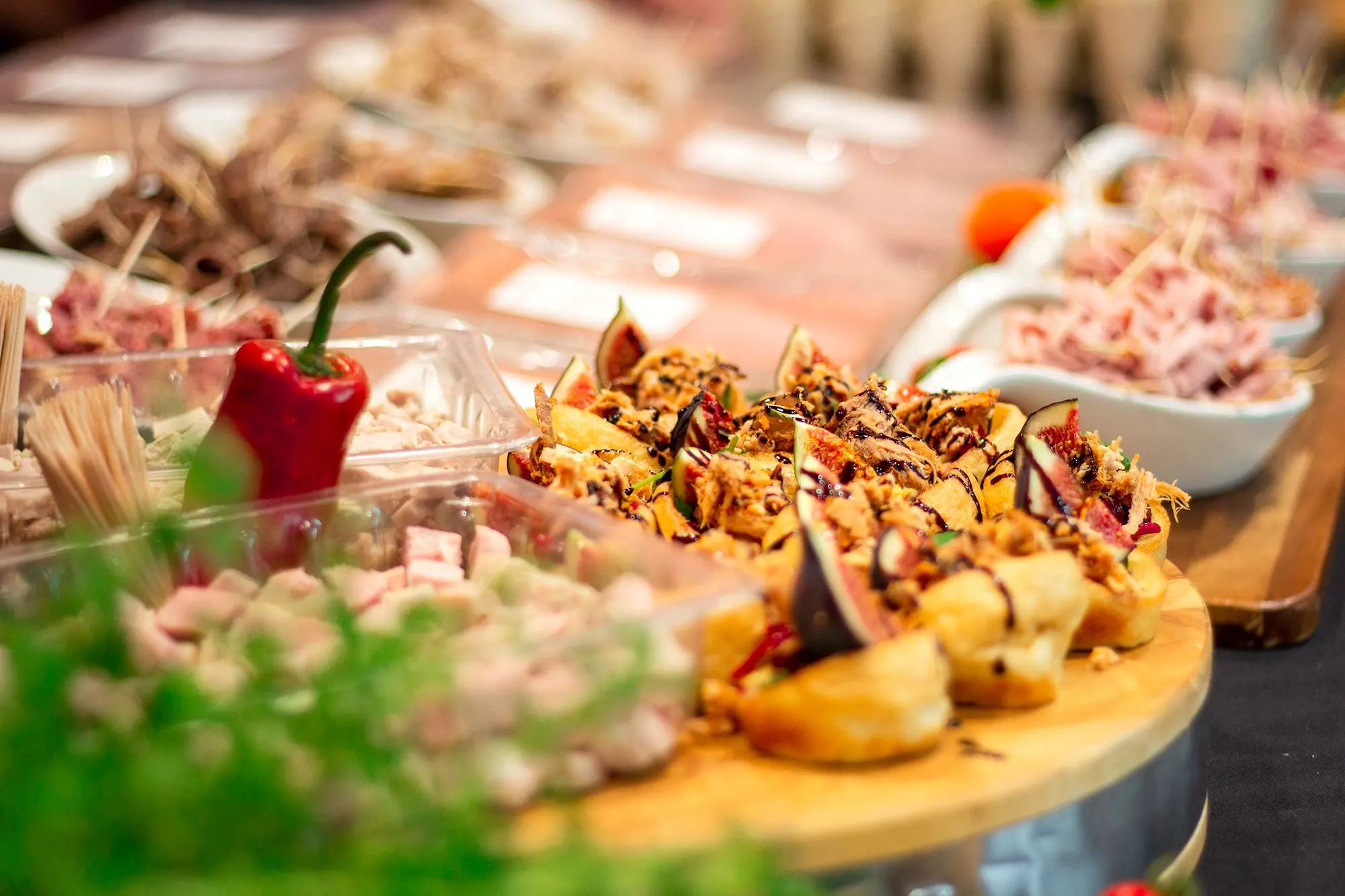 A spread of cooked meats and wraps prepared by the Browns development kitchen for a trade event